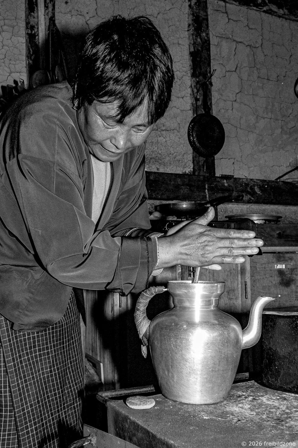 Preparing traditional butter-tea, Bhutan, 2012