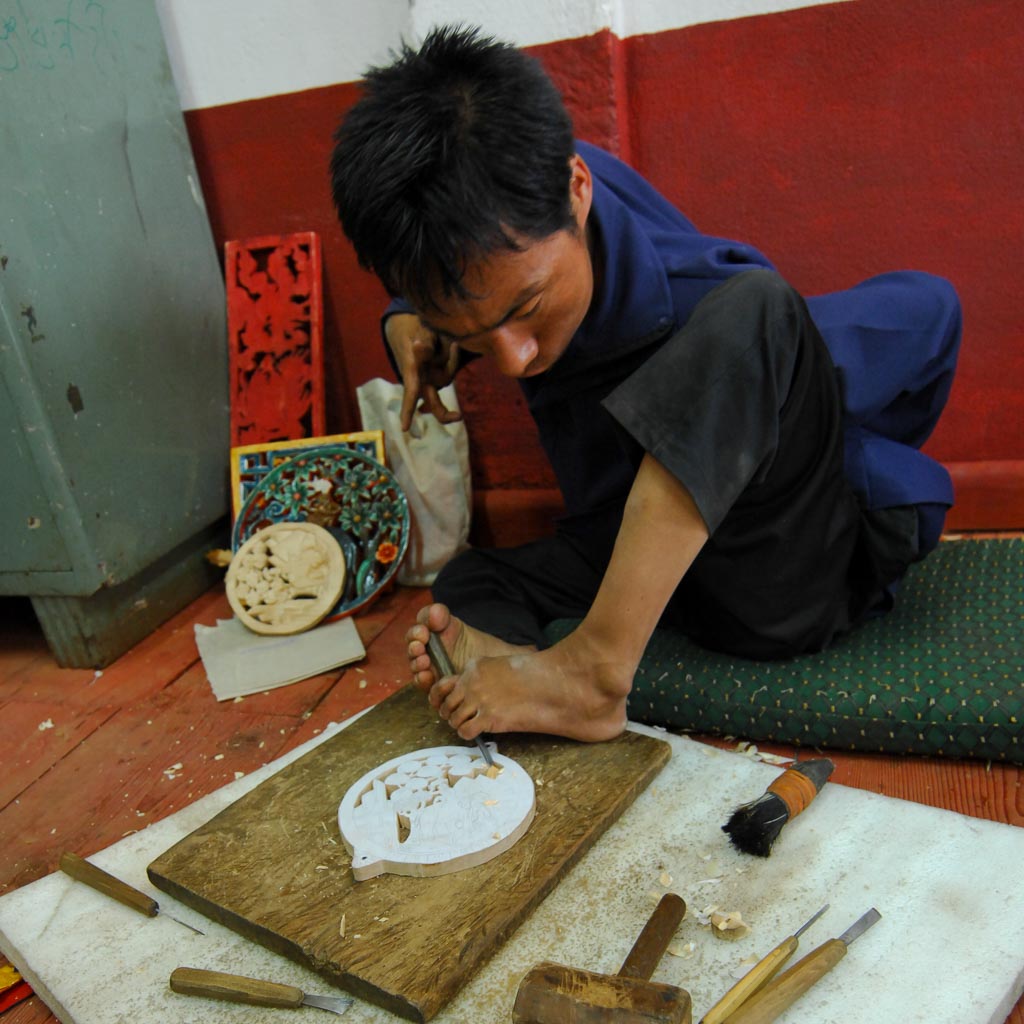 Wood carver in Thimphu Painting School, Bhutan