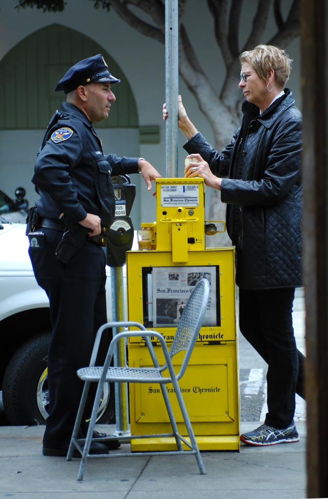 Policeman talking with woman, San Francisco, USA