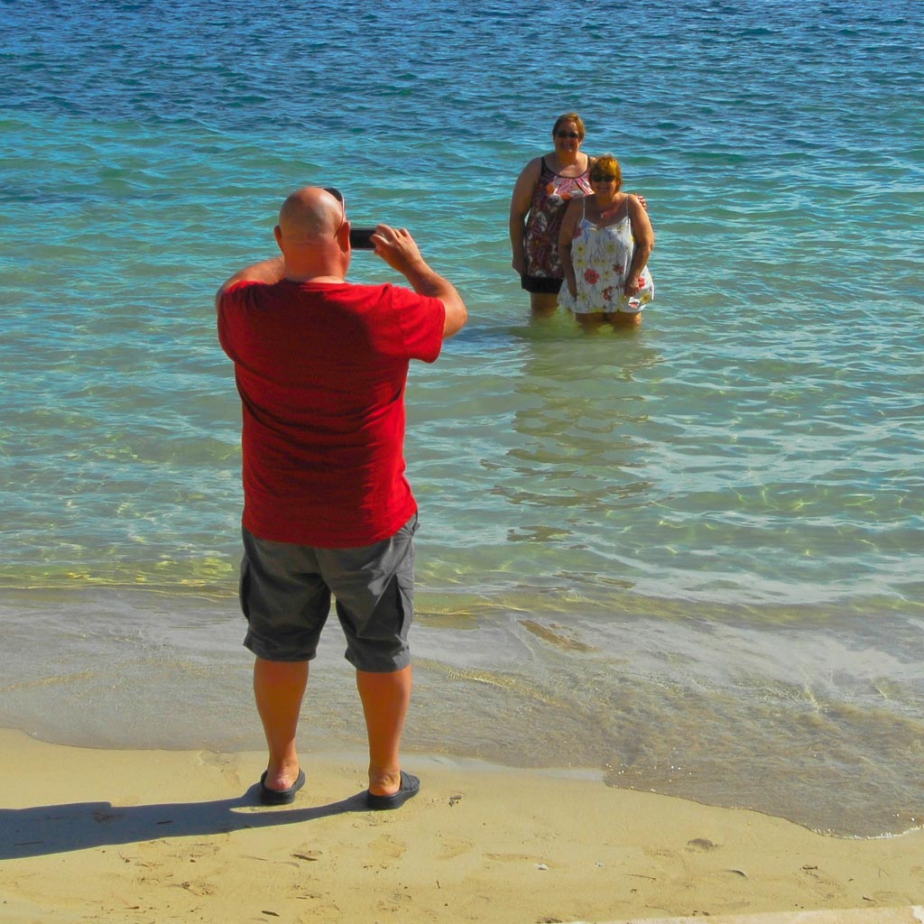 Tourist photo shooting on the beach, Majorca, Spain